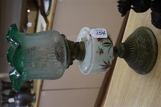 Two Victorian oil lamps and a centrepiece